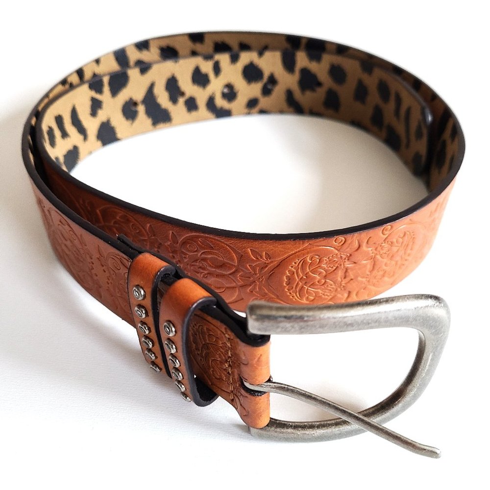Vegan tooled leather belt.